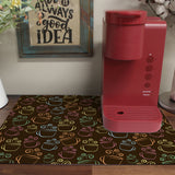 a red coffee maker sitting on top of a wooden table