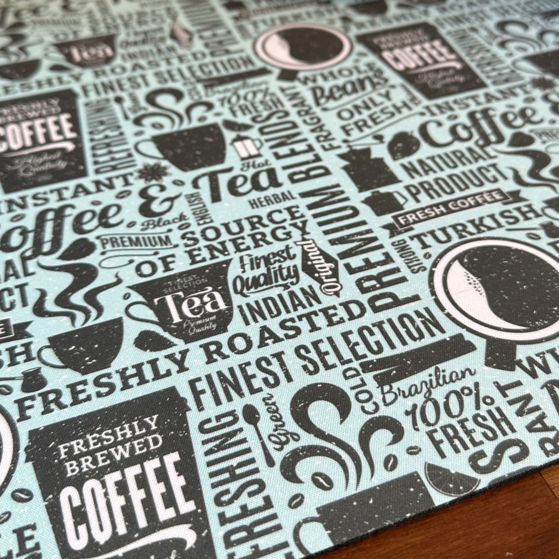 close up of blue newsprint coffee maker mat