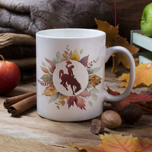 officially licensed Wyoming Bucking Horse™ mug, autumn leaves coffee mug, western fall drinkware, rustic Wyoming mug, cowboy seasonal mug, Bucking Horse™ ceramic mug, Wyoming fall gift