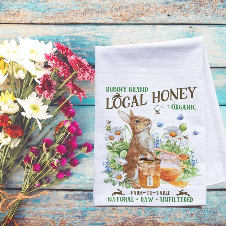 a bunch of flowers sitting next to a tea towel