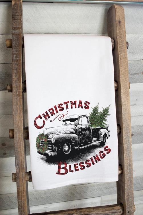 a christmas truck with a tree on the back of it