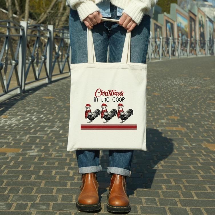 a person holding a white bag with christmas in the coop on it