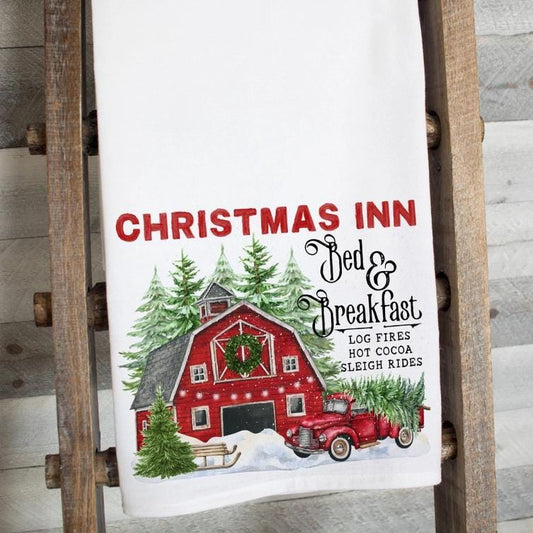 a christmas towel hanging on a wooden ladder