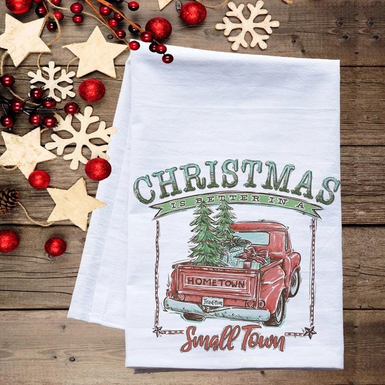 a tea towel with a christmas truck on it