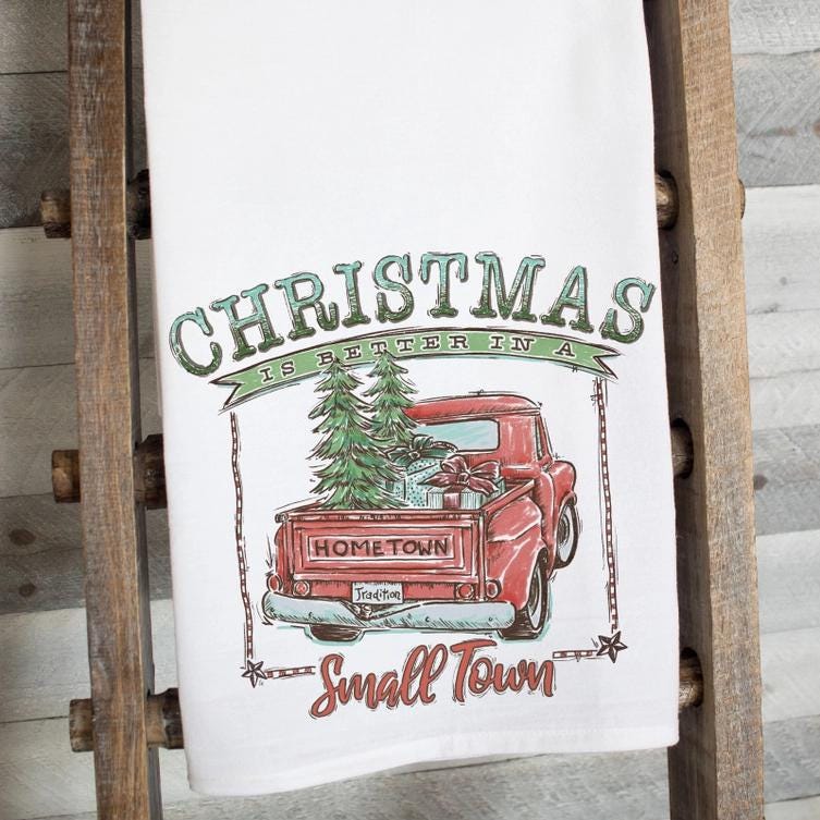 a red truck with a christmas tree on the back of it