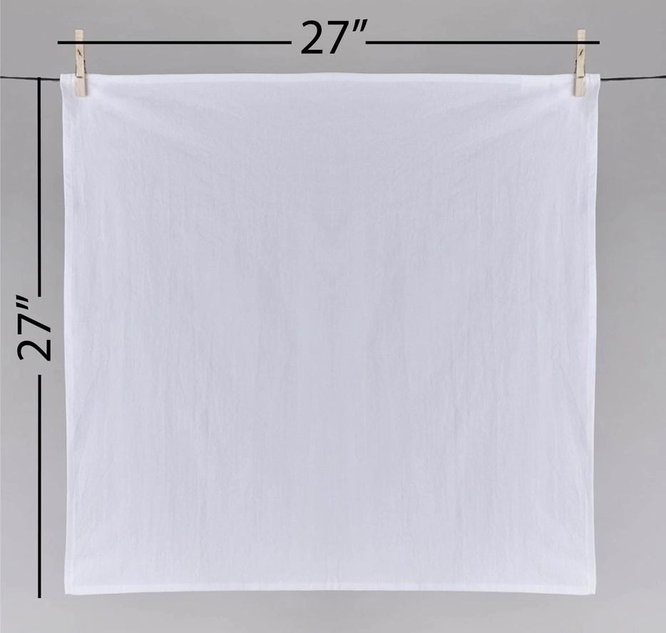 a white cloth hanging on a clothes line