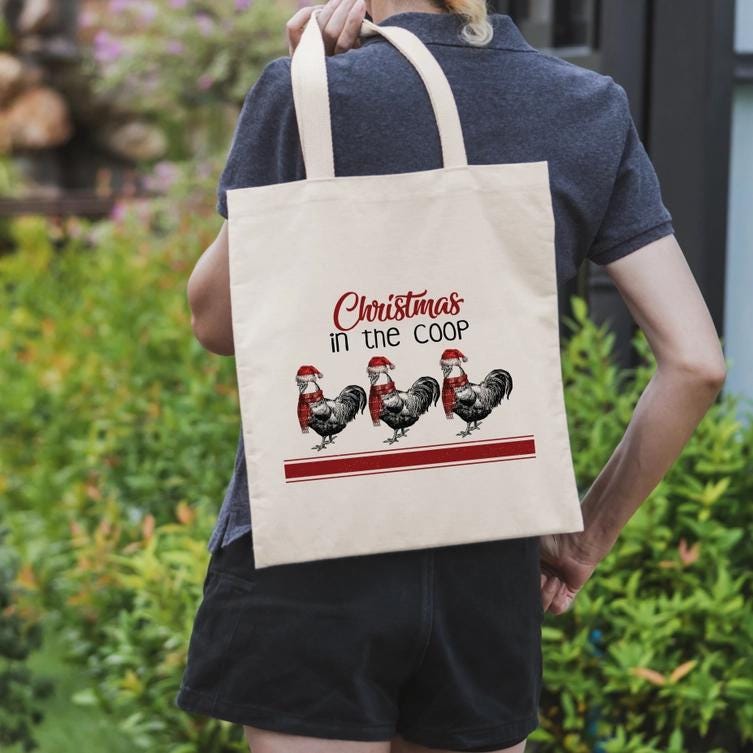 a woman holding a shopping bag with three chickens on it