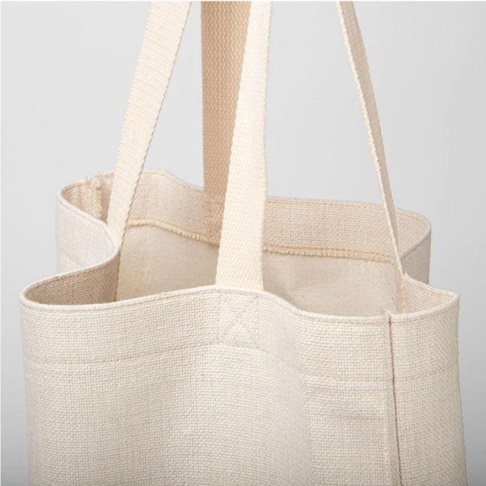 a white canvas bag with two handles