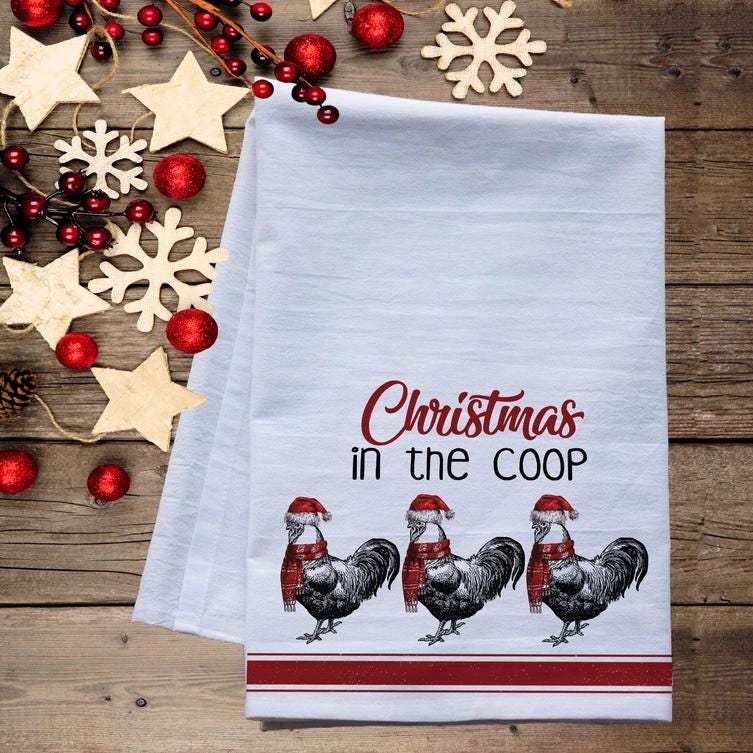 a kitchen towel that says christmas in the coop