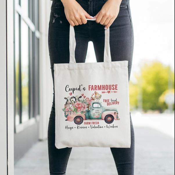 a woman holding a shopping bag with a picture of a farm house