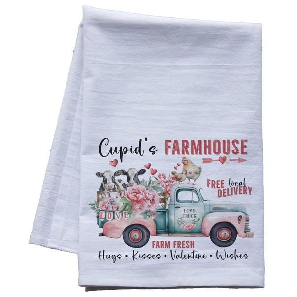 a tea towel with a truck and flowers on it