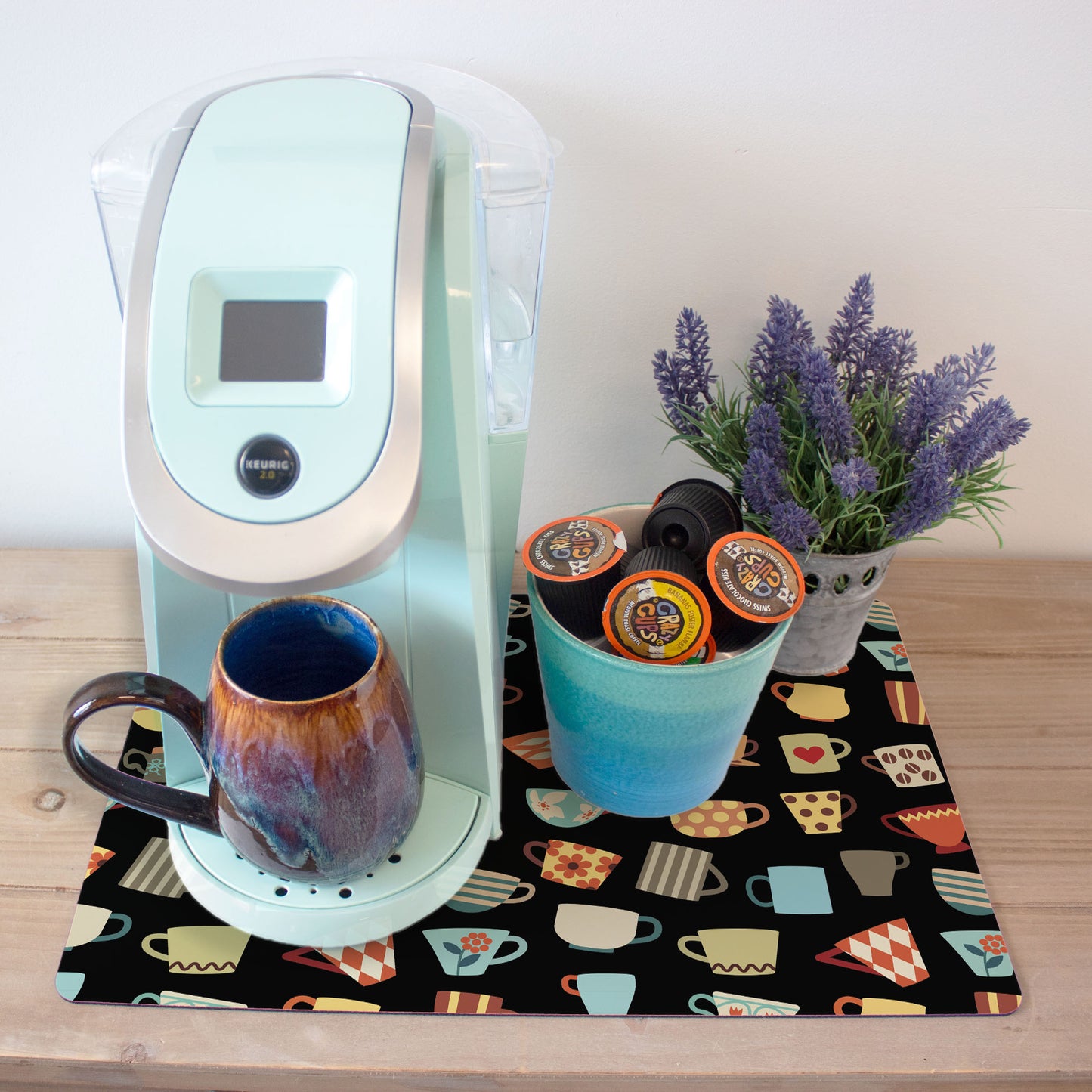 a coffee maker sitting on top of a wooden table