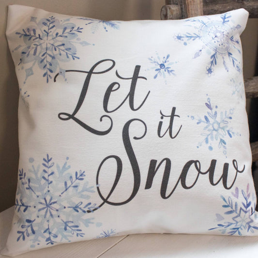 Let it Snow winter decor throw pillow with blue watercolor snowflakes