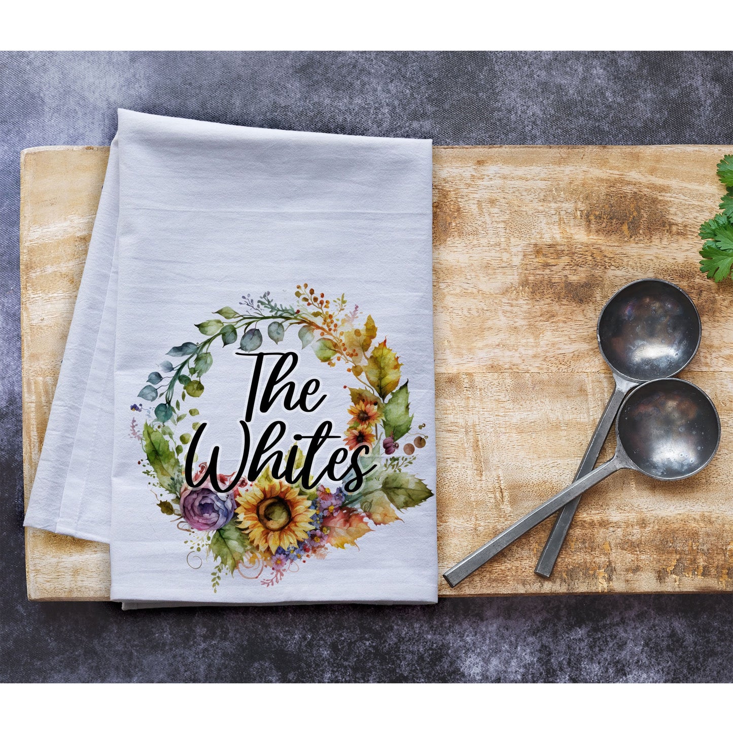 a napkin with the words the white&#39;s on it next to two spoons
